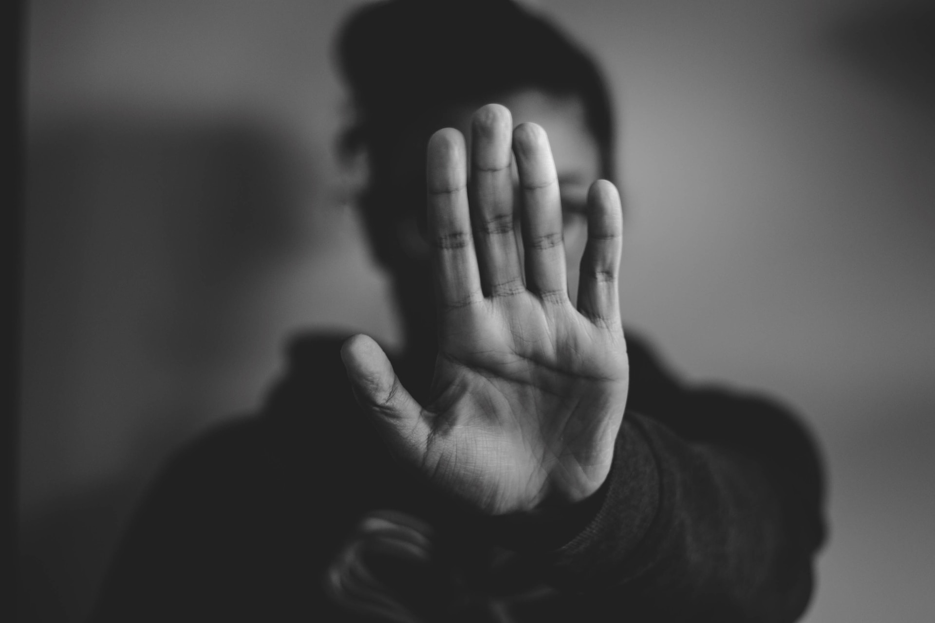 a hand raised as a stop sign